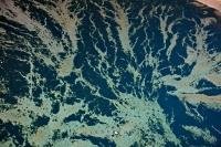 An array of abstract patterns created in the water off Malcolm Island in Broughton Strait, British Columbia, Canada. is observed from an aerial view of the Pacific Ocean.