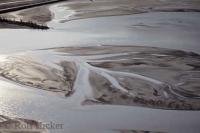 An aerial view of Kluane Lake in the Yukon Territory of Canada, a popular year round vacation destination for fishing, ice fishing, and summer time recreation.