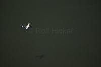 An Alaskan floatplane soars over the Gastineau Channel along the Inside Passage route near Juneau, Alaska.