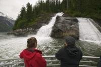 A waterfall is seen by tourist during Alaskan Cruising in the Tongass National Forest to the Sawyer Glacier in Tracy Arm Fjord.