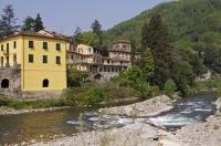 Beauty surrounds the Albergo Corona Hotel as the river sits outside its doorstep in the town of Bagni di Lucca in Tuscany, Italy in Europe.