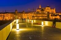 The famous and longest surviving bridge from ancient times leads over the Rio Guadalquivir towards the Mezquita in Cordoba, Andalucia, Spain.