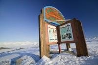 A magic place with a beautiful sign, the arctic circle crossing along the Dempster highway, photographed on a very cold winter day, Yukon, Canada.