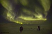 People watching the Aurora Borealis on an Alaskan night.