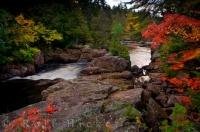 Autumn colors surround the banks of the Riviere du Diable in Parc National du Mont Tremblant in Laurentides, Quebec in Canada.