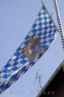 The flag of Bavaria waves in the wind in the town of Putzbrunn, Germany.