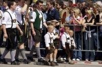 Crowds of people watching the parade in the Bavarian town of Putzbrunn near Munich, Germany.