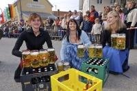 For the working men ladies served up plenty of Bavarian Helles Beer during the Maibaumfest in Putzbrunn, Germany.