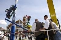 The Bavarian people attach local business signs to the Maibaum in Putzbrunn, Germany.