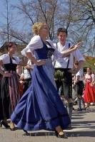 This Bavarian woman is very enthusiastic about dancing at the Maibaumfest in Putzbrunn, Germany.
