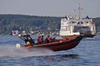 The Tri-Island BC Ferries vessel heads to Sointula followed by the Coast Guard 508 squad.