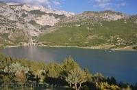The beautiful Lac de Ste Croix is a man made lake capturing the flowing waters of the Verdon River in the Alpes de Haute in Provence, France.