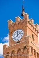 The Bell and Clock Tower of the Palazza Pubblico, the town hall, stands above Piazza Pio II, the main square in the historic old town centre in Pienza, which is a UNESCO World Heritage Site in Siena, in Tuscany, Italy.