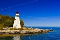 The first The Big Tub Lighthouse marks the entrance to the Big Tub Harbour near Tobermory on Lake Huron, Ontario, Canada.