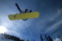 A snowboarder enjoys the snow terrain park on Blackcomb Mountain in Whistler, British Columbia, Canada.