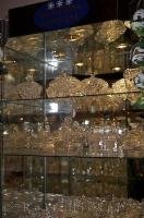 Glass shelves are lined with Bohemia Crystal at one of the shops along the lane that leads up to the Karlstein Castle in the Czech Republic.
