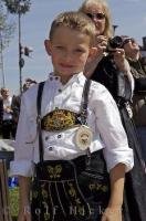 A boy proudly poses in his Bavarian German Lederhose in Putzbrunn, Germany.