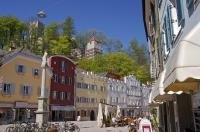 Colourful buildings and cafes line the streets of Bruneck in South Tirol, Italy, Europe.