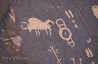 Ancient petroglyphs with symbols of buffalo, and other animals at Newspaper Rock near Canyonlands National Park, Utah.