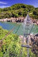 A popular tourist attraction in the Buller Gorge, the Buller River Swingbridge is a part of an Adventure and heritage park in the South Island of New Zealand.