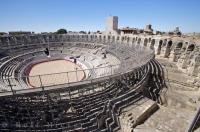 The Les Arenes which dominates old Arles, France is a historic bullfighting arena and the popular spectator sport of bullfighting is stilled hosted yearly at the arena.