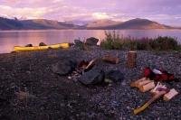 Kluane Lake in the Yukon of Canada is a great place to camp out for the night and sit around the camp fire with friends during a summer vacation.
