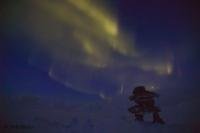 This Inukshuk seems to be striving to reach the Northern Lights in the Canadian Arctic. 