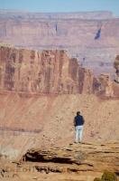 A visitor to Canyonlands National Park takes in the sights from Canyon Rim Recreational Area in Utah.