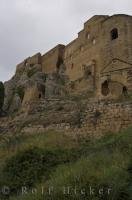 A historic castle roosts upon a rock cliff in Aragon, Spain where tourists come to explore and take picture after picture of the remains of this castle.