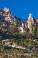 A winding road up the mountainside takes you to the ruins of the Castle of Guadalest and the church belfry in the town of Guadalest in Comunidad Valenciana, Spain.