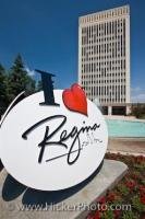 A view behind an 'I Love Regina' sign of the City Hall Building and fountain, located in Queen Elizabeth II Court in Regina, the province of Saskatchewan, Canada. Opened in 1976, it became the new City Hall after the old one was demolished.