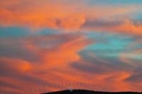 Wispy clouds look like cotton candy at sunset over Sedona in Arizona, USA.