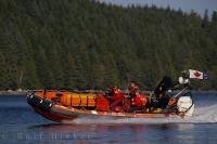 A crew of three from the Canadian Coast Guard check the shoreline of Malcolm Island, British Columbia.