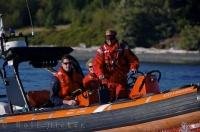 The Canadian Coast Guard in a zodiac off Malcolm Island in British Columbia, Canada.