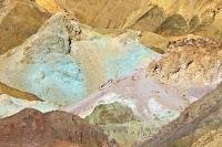 Shades of blue and red appear as though they've been splashed onto the face of the colourful Black Mountains at the Artists Palette in Death Valley National Park, California, USA.