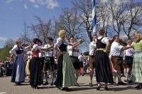 A group of couples dancing at the Maibaumfest in Putzbrunn, Germany.