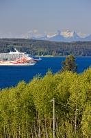 A large cruise ship sails through Broughton Strait, between Malcolm Island and Vancouver Island in British Columbia, Canada.