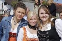 These cute girls are residents of Bavaria enjoying the Maibaumfest in Putzbrunn, Germany.
