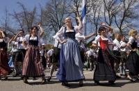 The lively choreography of a traditional Bavarian dance is performed in Putzbrunn, Germany.