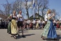 Couples begin a dance routine during the Maibaumfest in Putzbrunn, Germany.