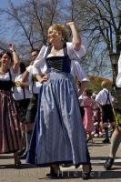 A woman performs the steps of a traditional Bavarian dance in Putzbrunn, Germany.