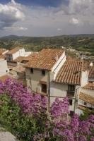Houses line the village of Morella in Valencia, Spain overlooking the countryside of El Maestrat.
