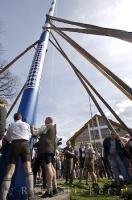 This blue and white pole is a historic symbol at the European Maibaumfest in Putzbrunn, Germany.