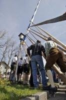 A traditional pole is used to stand the Maibaum up in this European village near Munich, Germany.