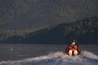 A pair of Evinrude outboards power an inflatable boat in Johnstone Strait, British Columbia, Canada.