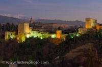 The Alhambra (La Alhambra) is a UNESCO World Heritage Site in the City of Granada and the exterior is lit up at dusk to show off the Moorish palace and fortress in all its architectural wonder. It was built in the 14th century and is still standing today.