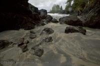 Water flows through a passage into the wide open ocean in San Josef Bay on Northern Vancouver Island in BC, Canada.