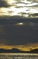 Sunset colors are considerably enhanced by the cloudy skies around Northern Vancouver Island in British Columbia, Canada.