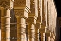 Finely detailed columns within the Chamber of the Lions at Alhambra Palace are among the most famous pieces of architecture in the city of Granada, Andalusia, Spain.