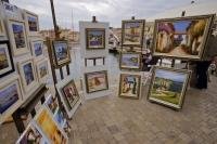 The waterfront of St Tropez is lined with stalls of art by local French artists of the Provence.
